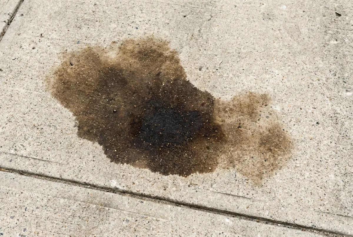 Oil staining on a concrete driveway